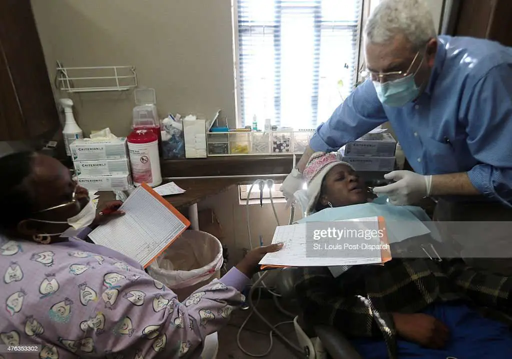 Dentist Tom Farmer pulls an aching tooth from Medicaid patient... News ...